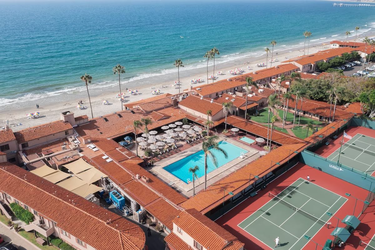 Aerial view of the tennis courts at La Jolla Beach & Tennis Club with the Pacific beyond